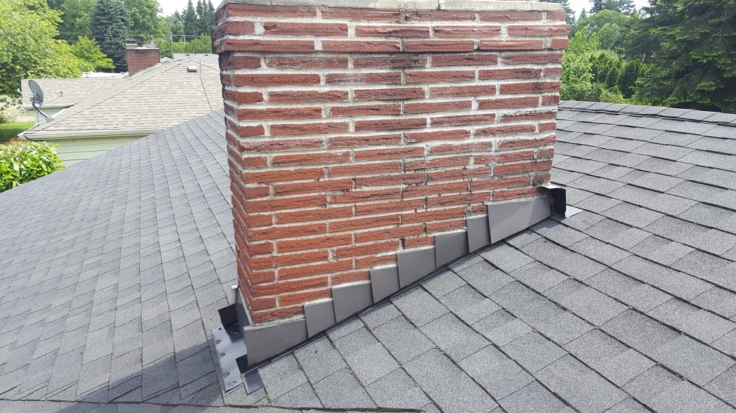 New chimney step flashing installed.