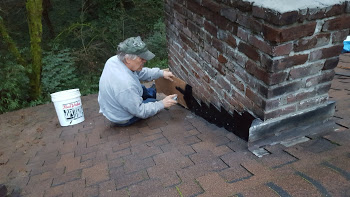 Chimney flashing being installed