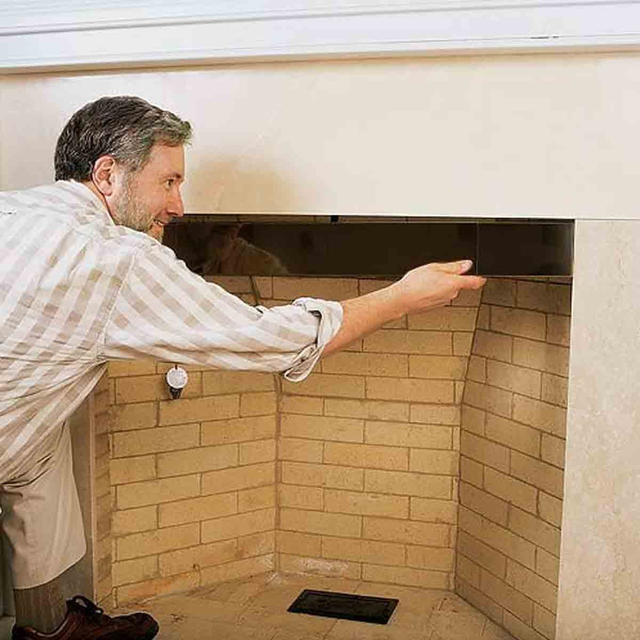 Fireplace smoke guard. This affixes to the top of the fireplace opening to keep smoke from rolling out of the top of the fireplace opening.