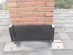 Chimney flashing - corners caulked.