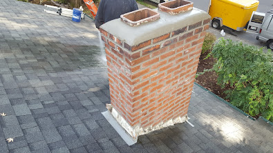 A completed tuckpoint repair of a chimney.